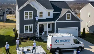Professional house painters working on exterior home in Harrisburg, PA