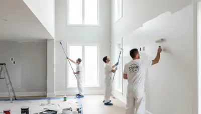 Professional interior house painters working in Harrisburg, PA living room with fresh wall colors